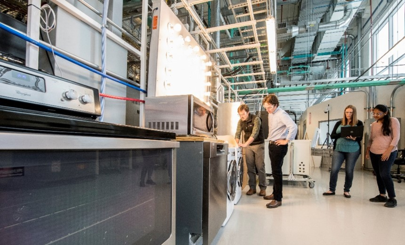 NREL researchers working in the System Performance Laboratory at the Energy Systems Integration Facility. 