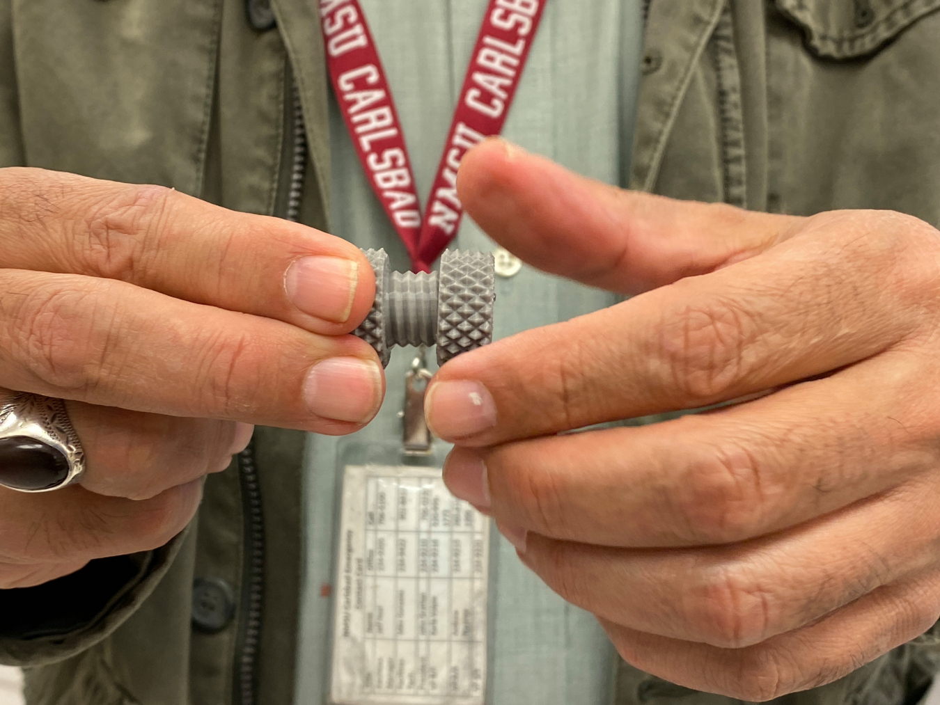 Engineering Professor Jamil Al-Nouman demonstrates a nut-and-bolt assembly printed on New Mexico State University Carlsbad’s 3D printer. The components are printed as one unit, demonstrating the capabilities behind the technology. The college is using 3D printing as an additional training tool to prepare students for upcoming opportunities in the technology and manufacturing sectors.