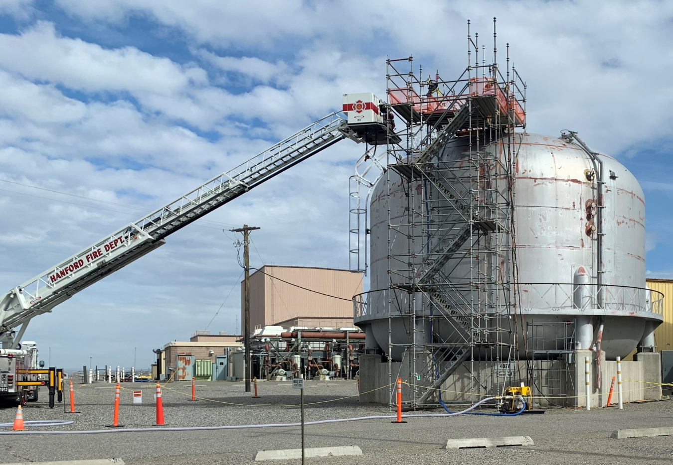 Workers with EM contractor Hanford Mission Integration Solutions installed scaffolding to get divers, support crews, and specialized equipment safely to the top of 50-foot-tall water tanks so that divers could inspect their interiors.