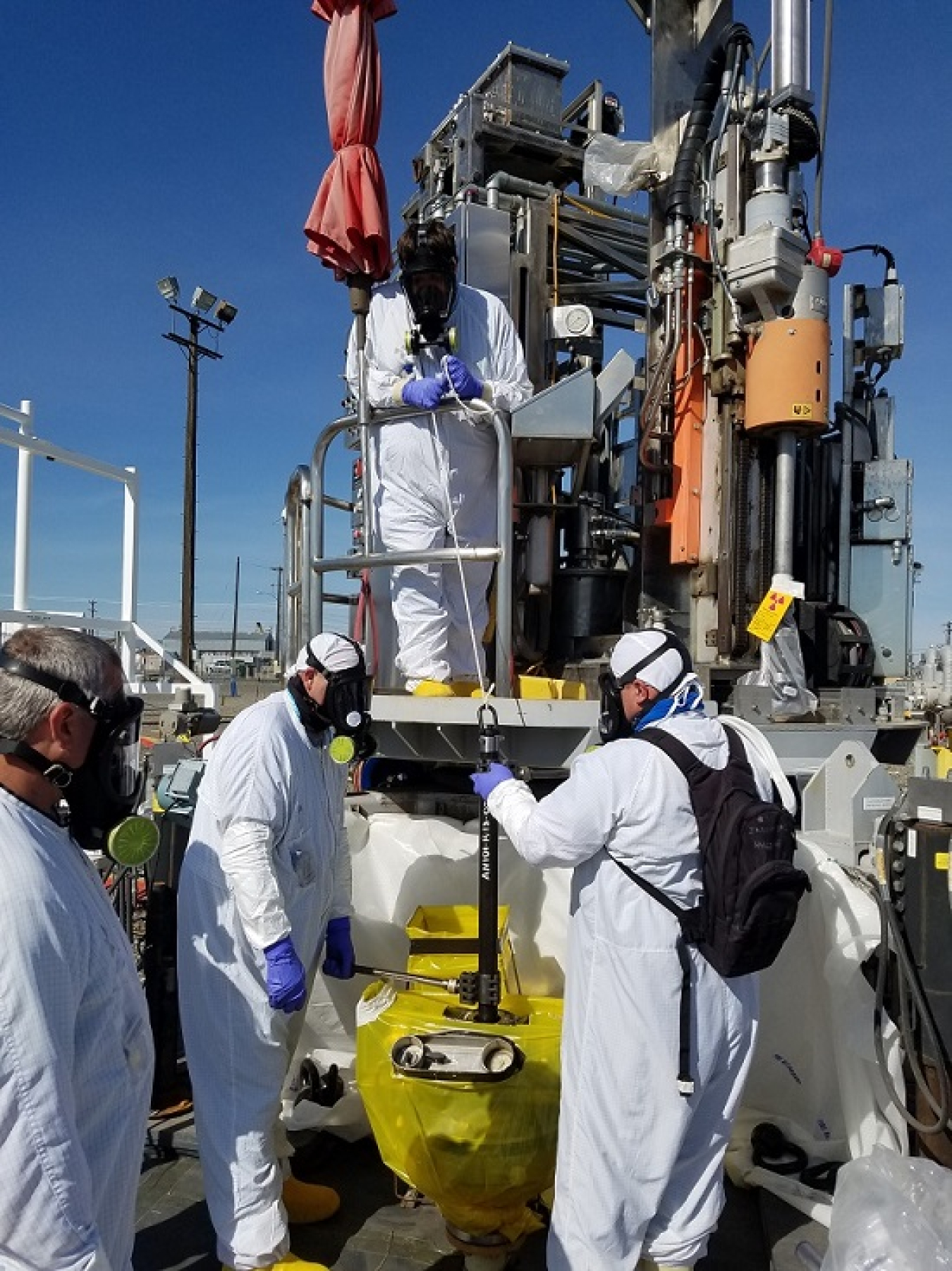 A crew with Office of River Protection tank farms operations contractor Washington River Protection Solutions sets up a work platform to take a core sample from double-shell Tank AN-101. Core samples provide engineers with valuable data in their efforts to combat corrosion and maintain the structural integrity of Hanford’s double-shell waste storage tanks.