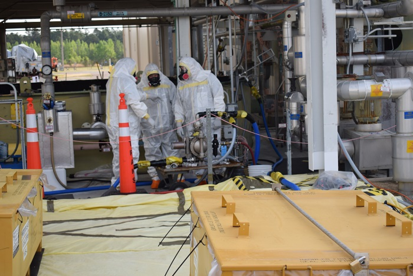 Workers prepare to remove sediment from the L Basin settler tank at the Savannah River Site.