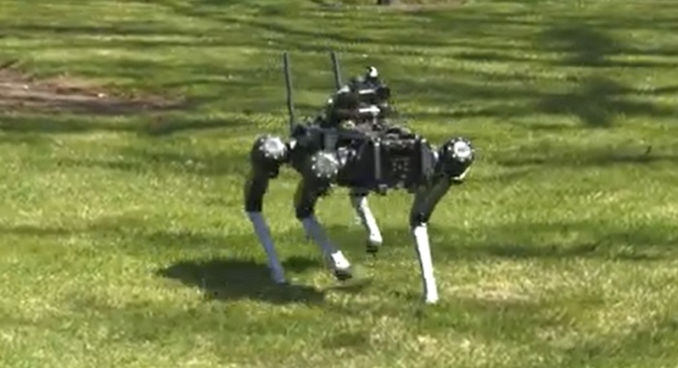 Taking the “dog” for a walk: Central Plateau Cleanup Company Radiation Area Remedial Action Manager Roy Plunkett tries his hand at the controls of a four-legged, remotely operated robot that aims to improve worker safety and increase productivity at Hanford.