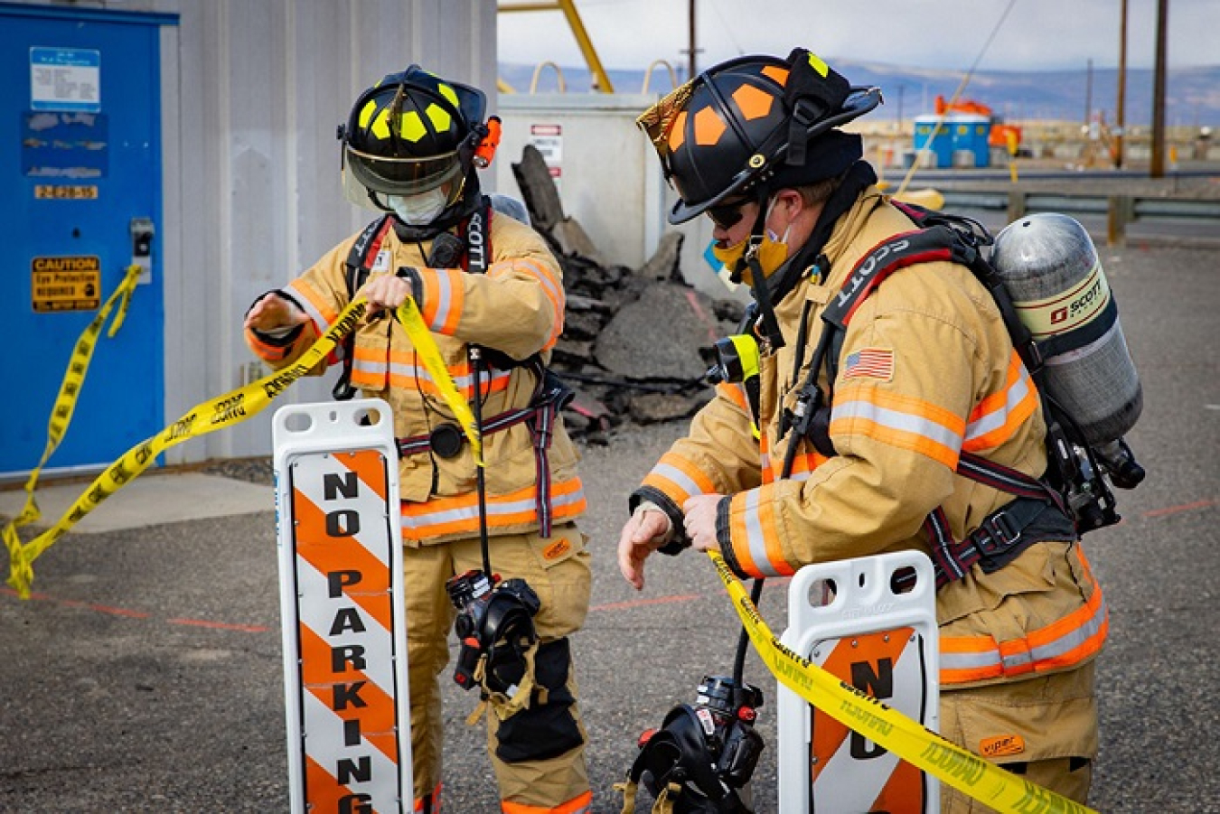 Members of the Hanford Fire Department take part in an emergency exercise on the Hanford Site, simulating a contamination and take-cover alert.