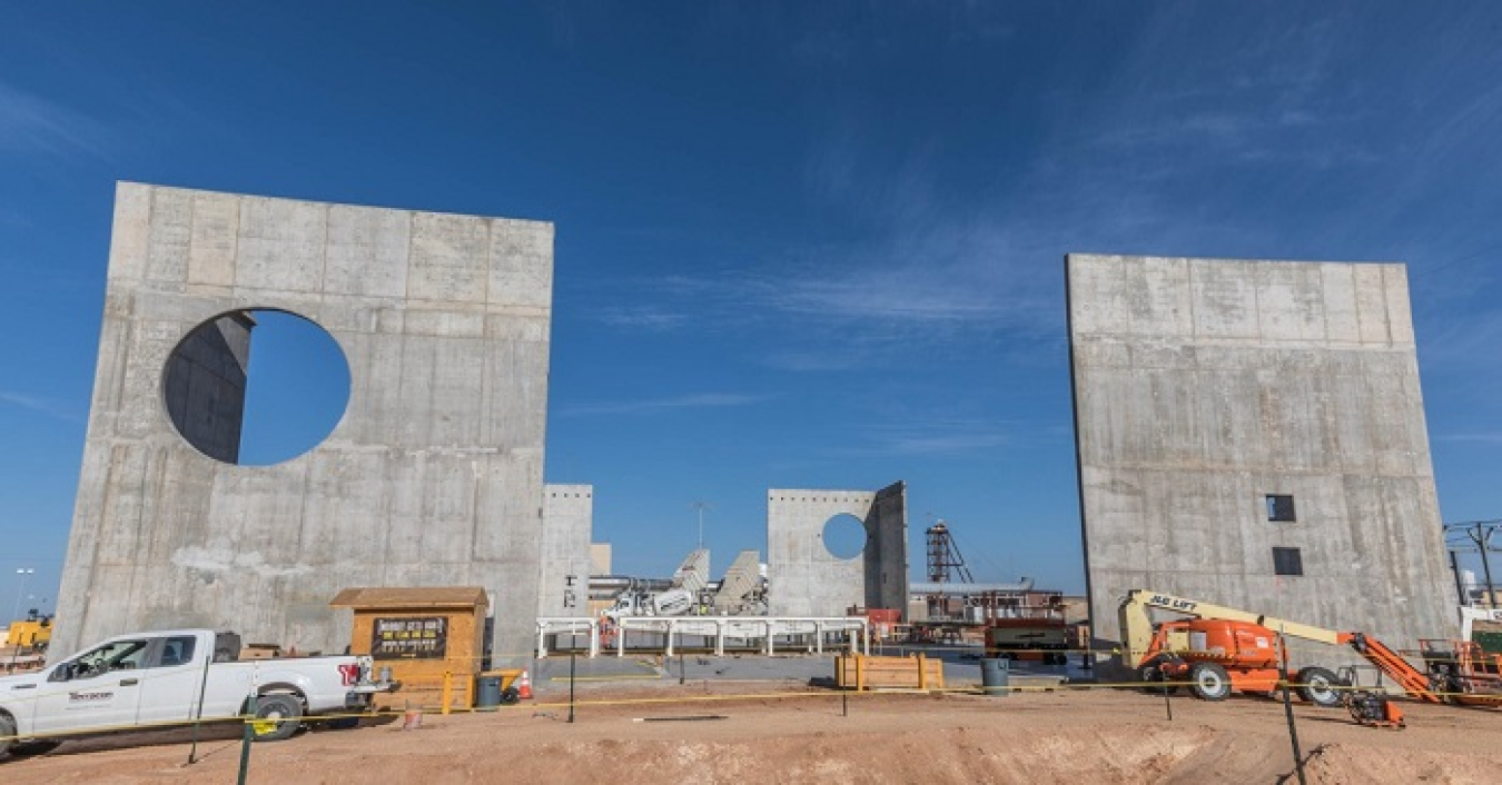 Supporting walls of the Waste Isolation Pilot Plant (WIPP) Salt Reduction Building stand 41 feet high. The round holes in these structures are for inbound and outbound air from WIPP’s underground.