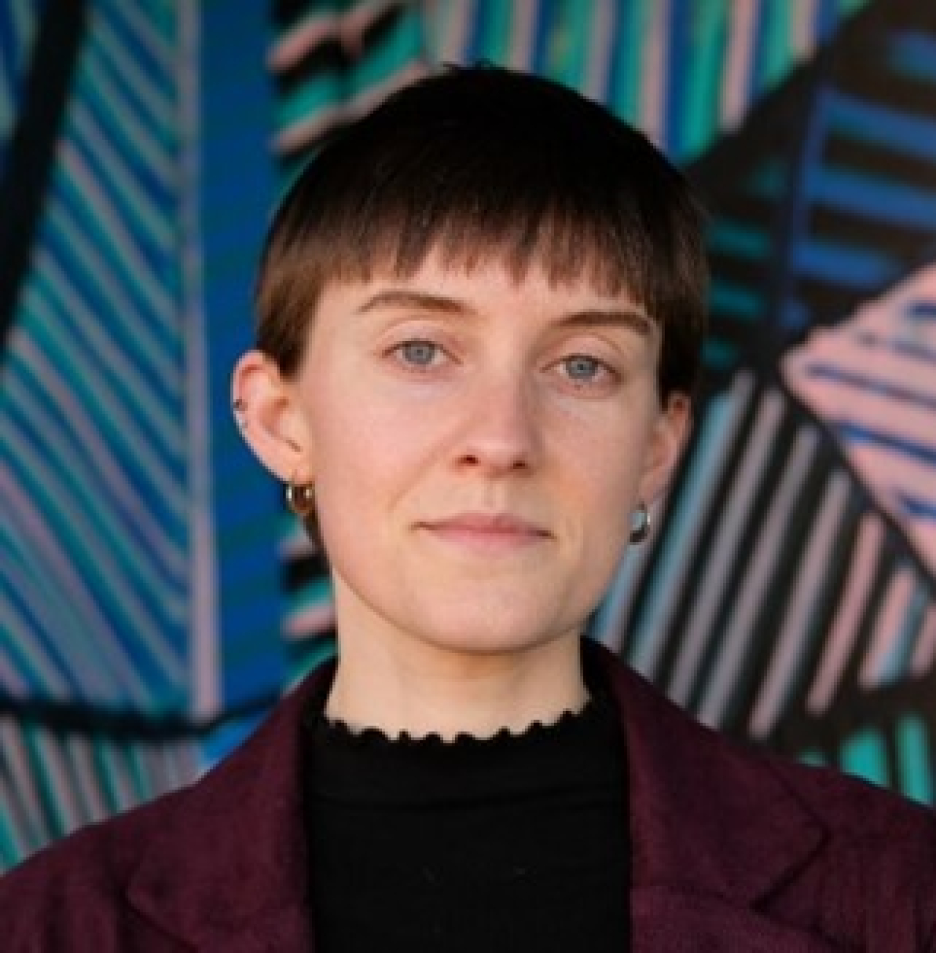 Headshot of a woman smiling.