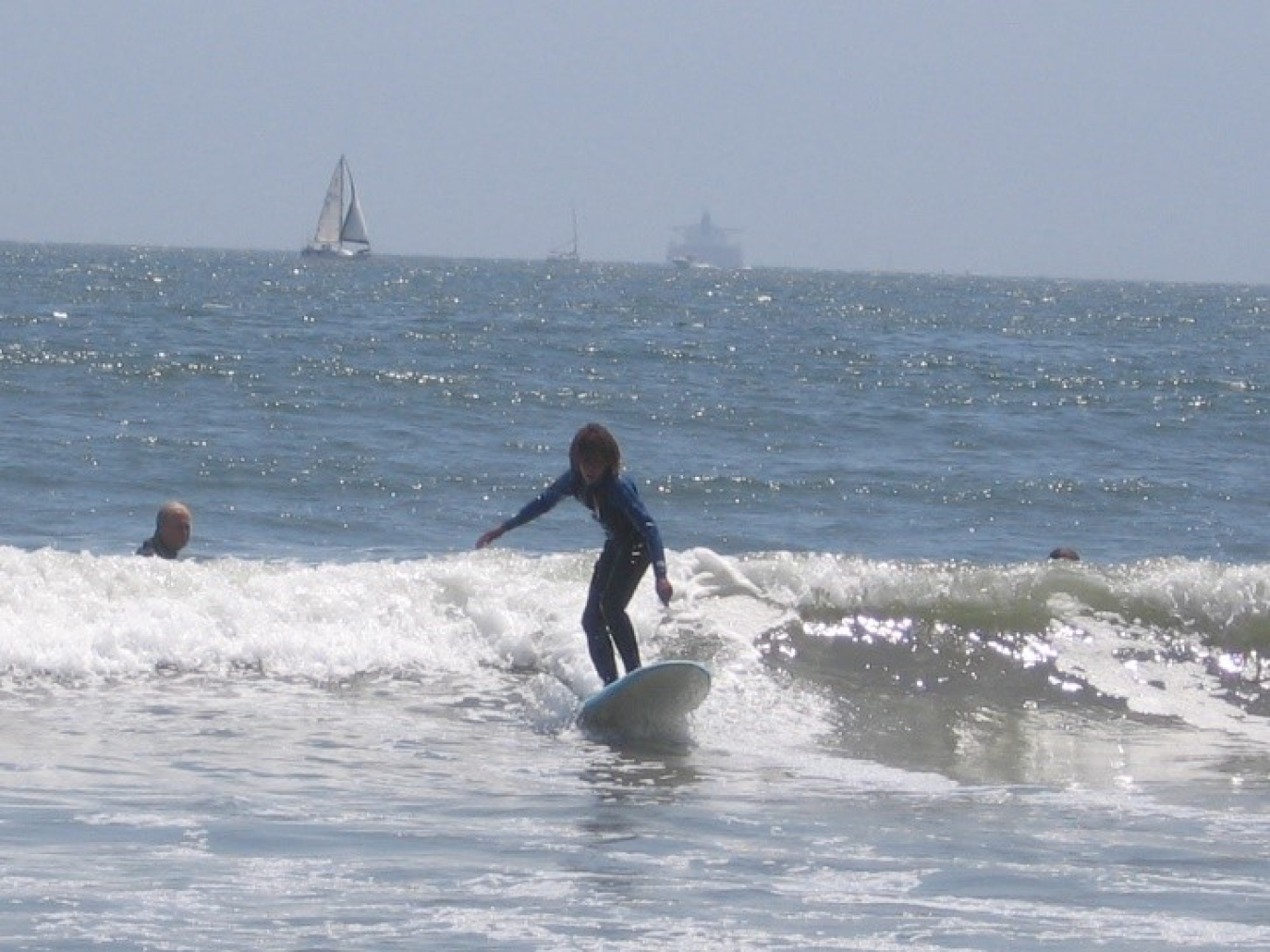 A boy surfing.