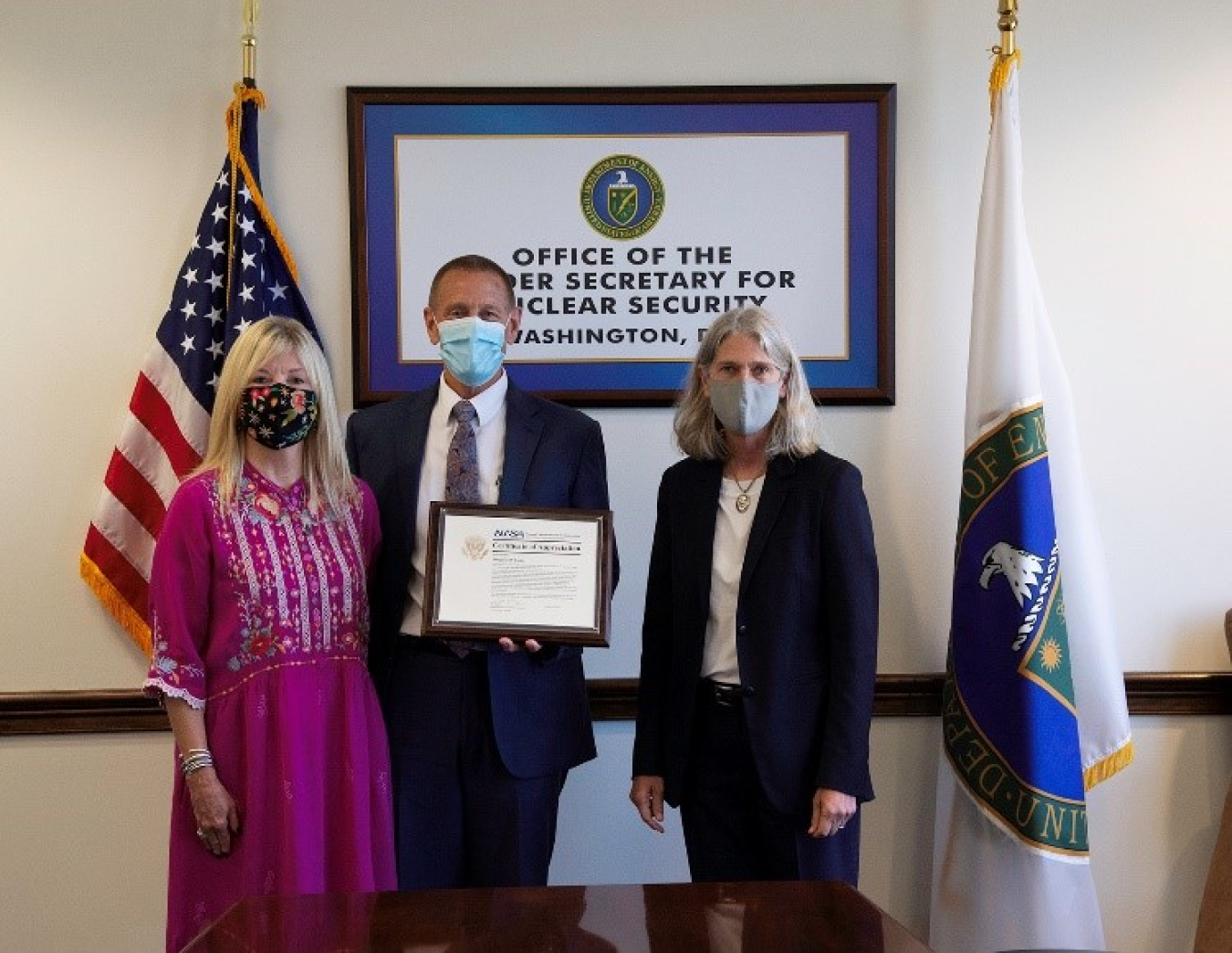 Doug Cotter with his wife, and Administrator Hruby