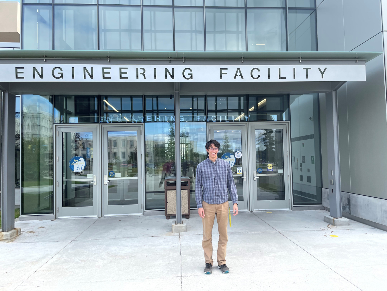 Photo of Logan Borger standing outside the UAF Engineering Building