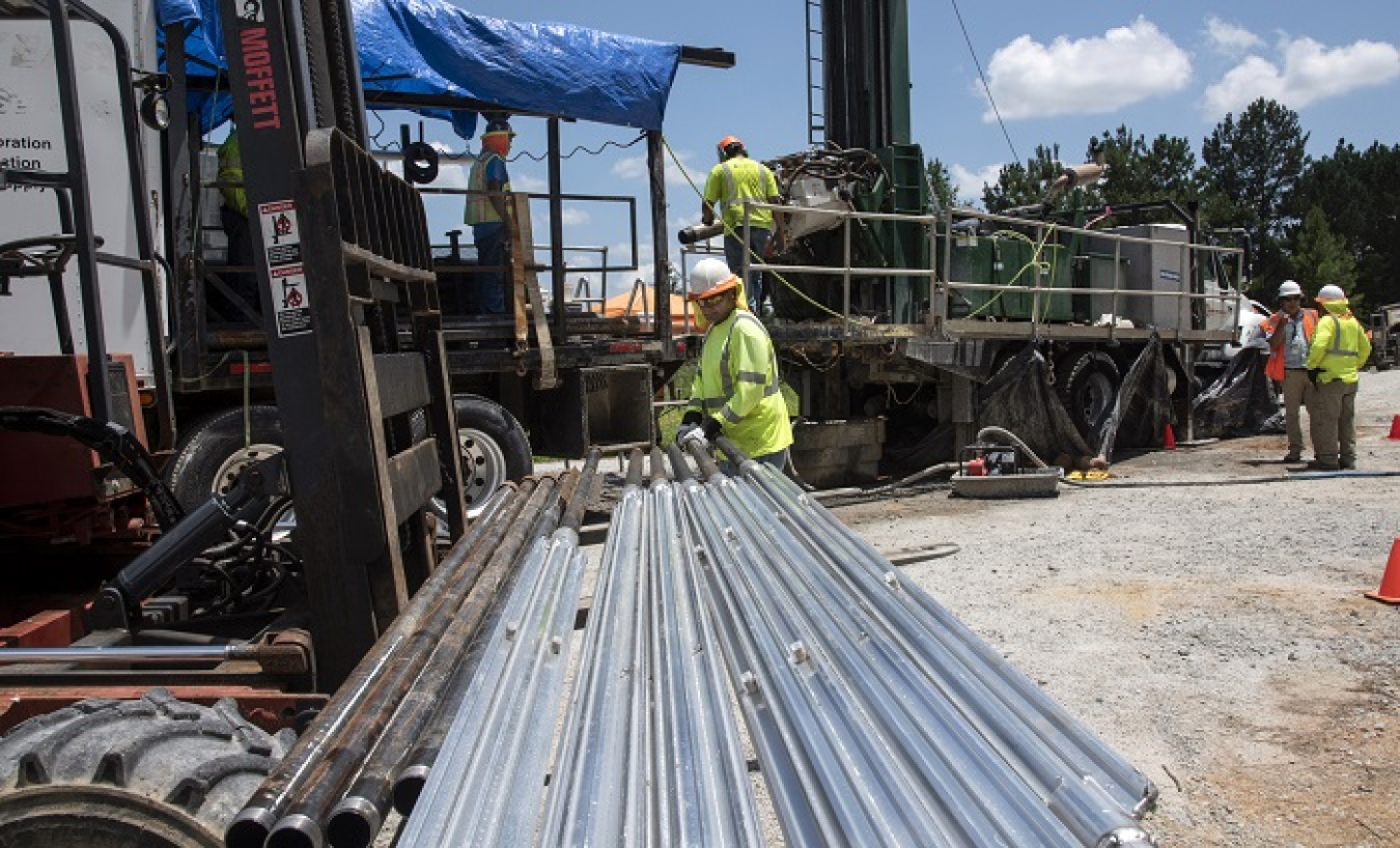 Injecting material containing iron filings into wells at the Savannah River Site is a multi-step process. Using 22 wells, workers created a wall three basketball courts in length, about 4 inches thick, and extending 135 feet below the earth's surface at its deepest point. The porous wall neutralized degreasing solvents, like those found at dry-cleaning stores, as groundwater passed through it.