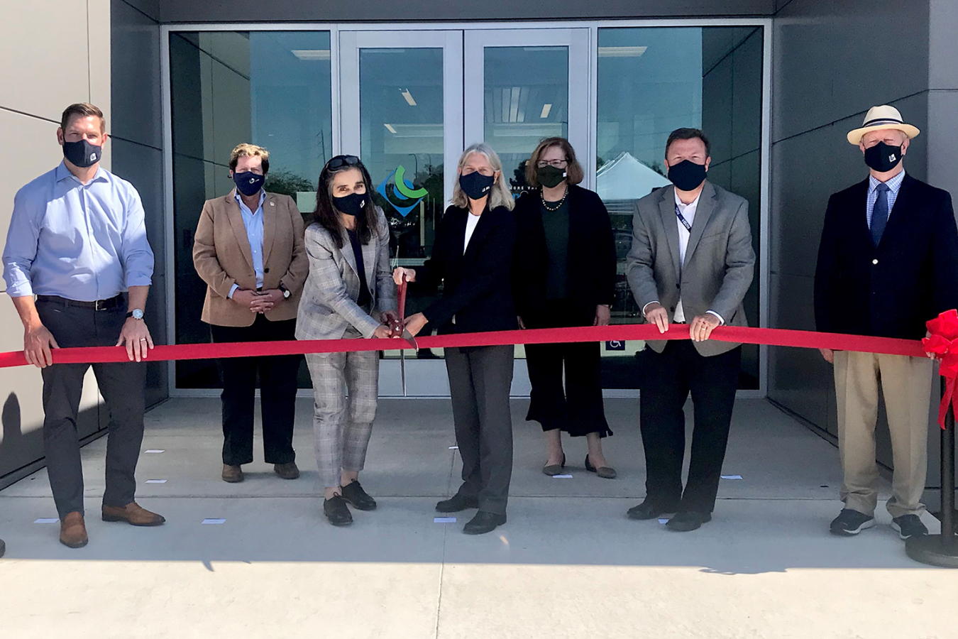 NNSA administrator, flanked by government and Lawrence Livermore National Laboratory officials cuts ribbon on new LVOC facility