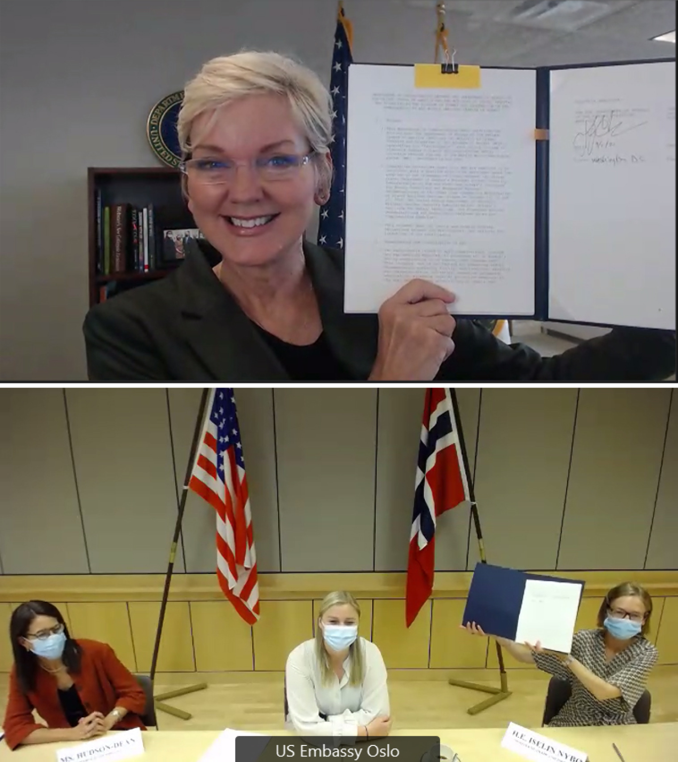 Secretary of Energy Jennifer M. Granholm, top, and Norwegian Minister of Trade and Industry Iselin Nybø hold up signed versions of the memorandum of understanding to advance a cooperative project to eliminate all of Norway’s highly enriched uranium.