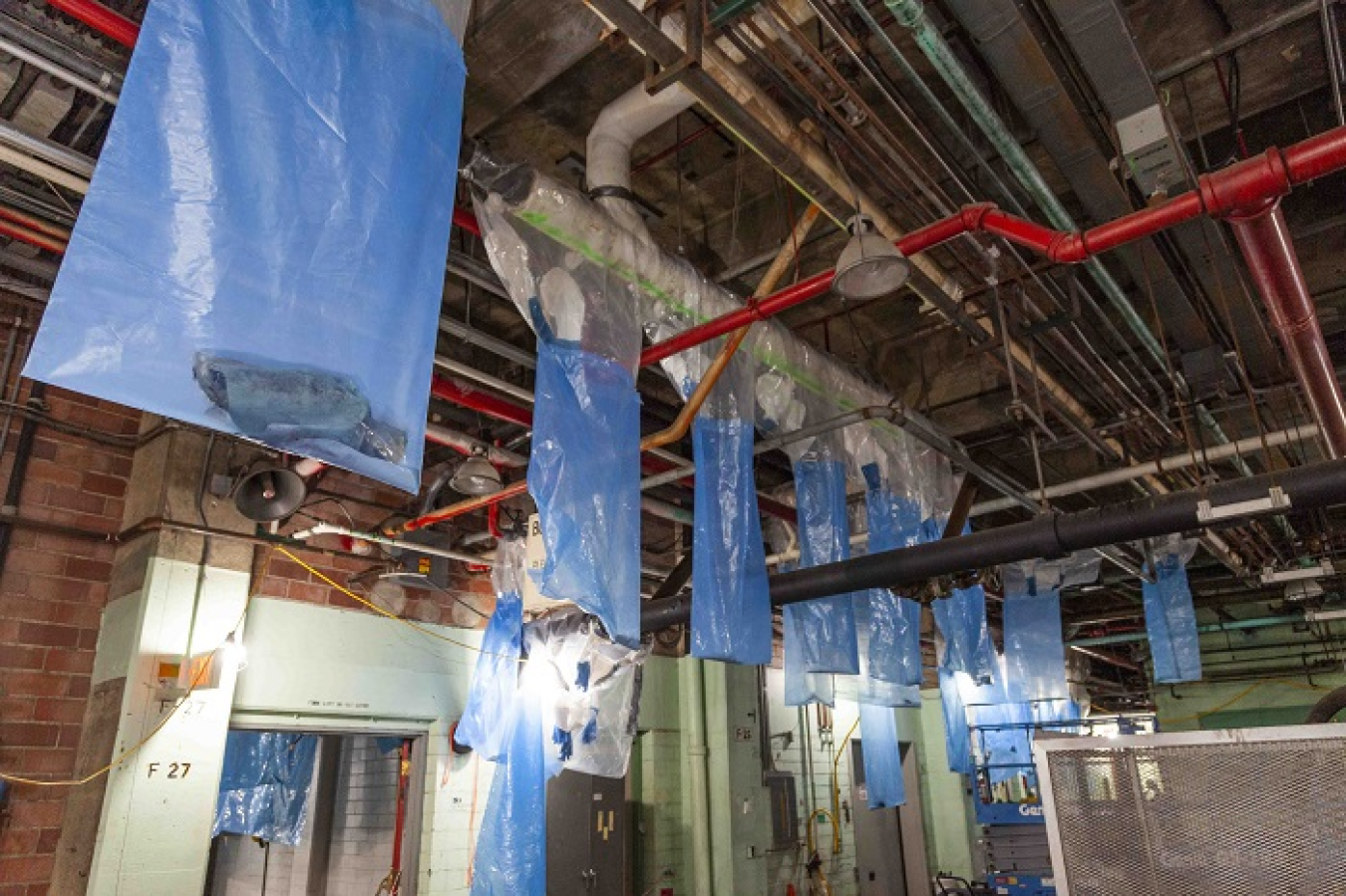 EM crews pre-staged and hung bags throughout the Beta-1 facility at the Y-12 National Security Complex before removing asbestos-containing materials.