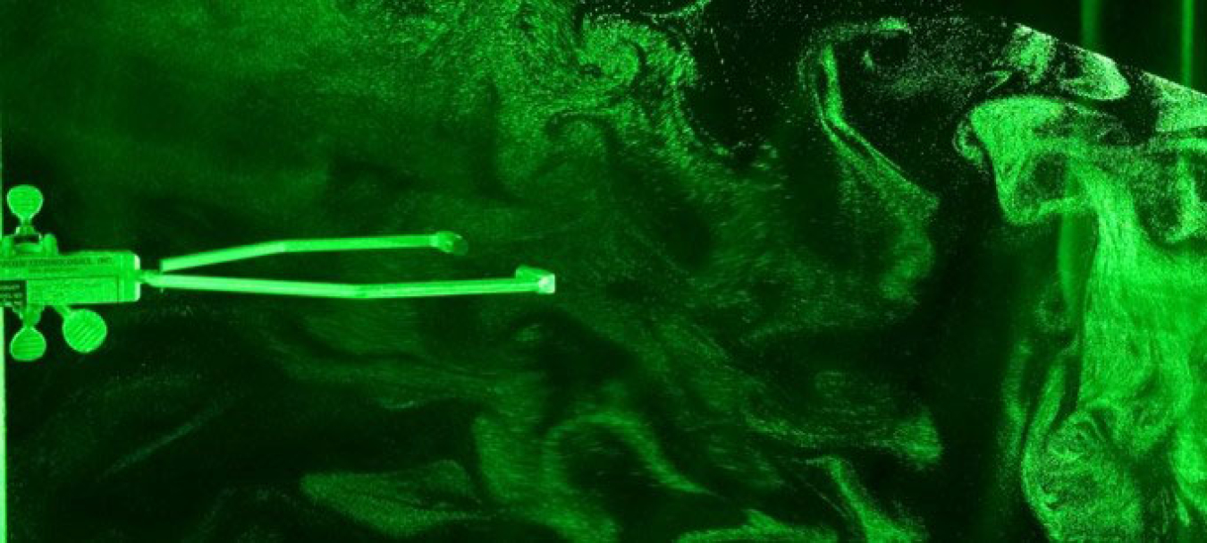 A sonic temperature sensor and cloud droplets in the laser sheet inside Michigan Tech's cloud chamber.