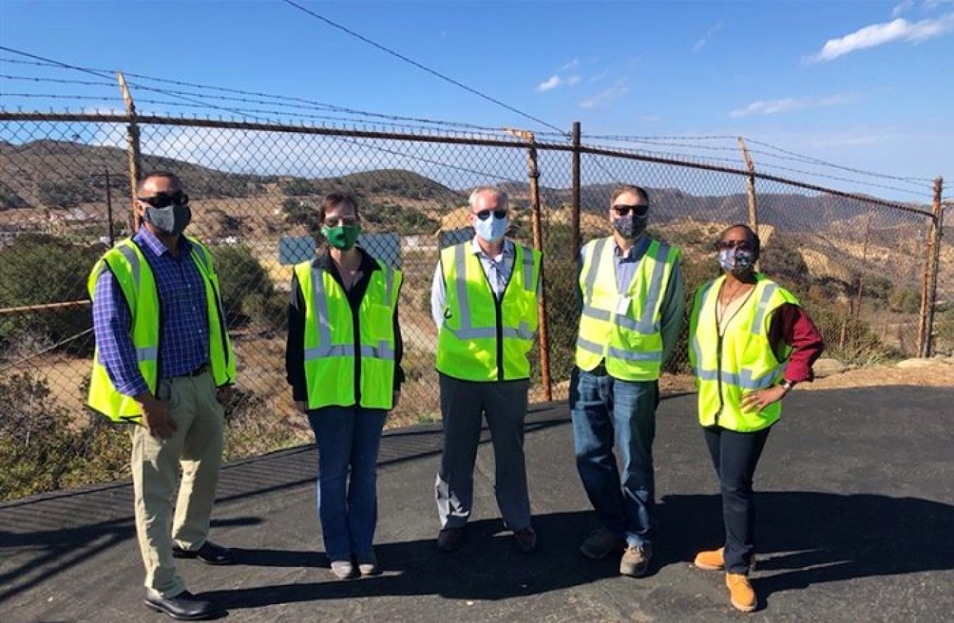 EM officials gather at the site of the recent demolition of the final DOE-owned buildings at the Energy Technology Engineering Center (ETEC). From left are EM Site Liaison Coordinator John Jones, EM Acting Director of Regulatory, Intergovernmental and Stakeholder Engagement Kristen Ellis, EM Acting Assistant Secretary William "Ike" White, Acting ETEC Federal Project Director Josh Mengers, and Environmental Management Consolidated Business Center Deputy Director Melody Bell.