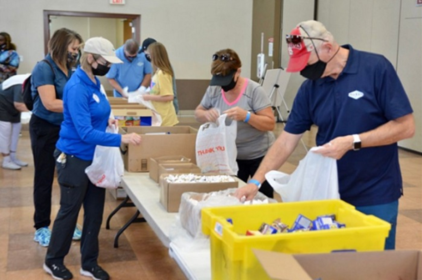 Team Navarro walkers prepare sack lunches for the Las Vegas Rescue Mission. Navarro employees recently participated in the “Walk a Mile in My Shoes” fundraiser for the mission as part of the Navarro Research and Engineering Community Commitment Plan.