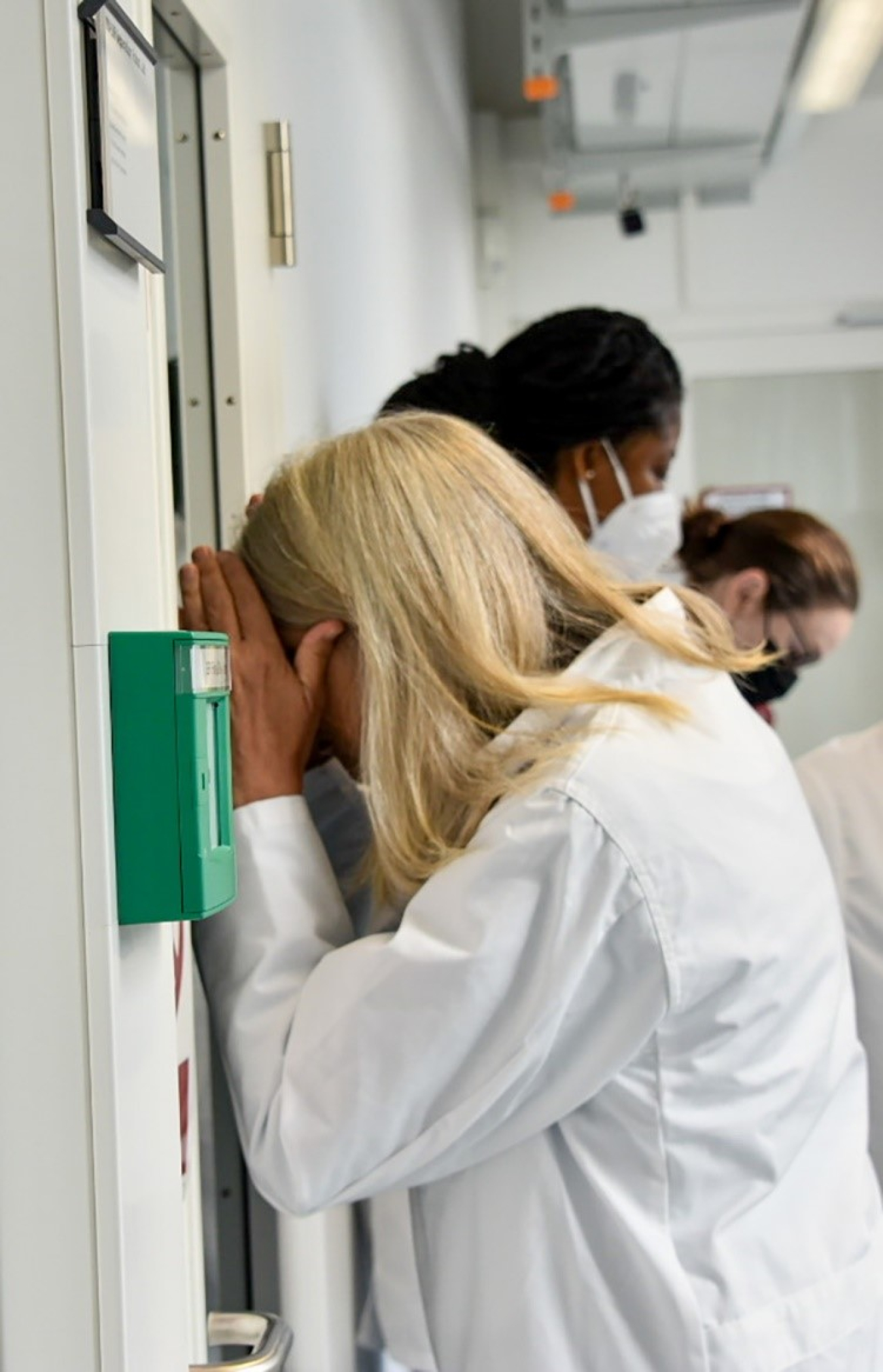 NNSA Administrator Jill Hruby peers through a lab window