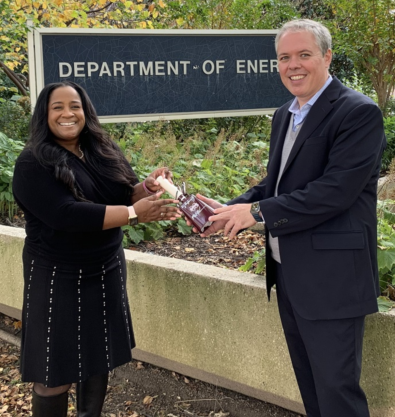 White and Nelson-Jean are pictured outside the Energy Department headquarters in Washington, D.C.