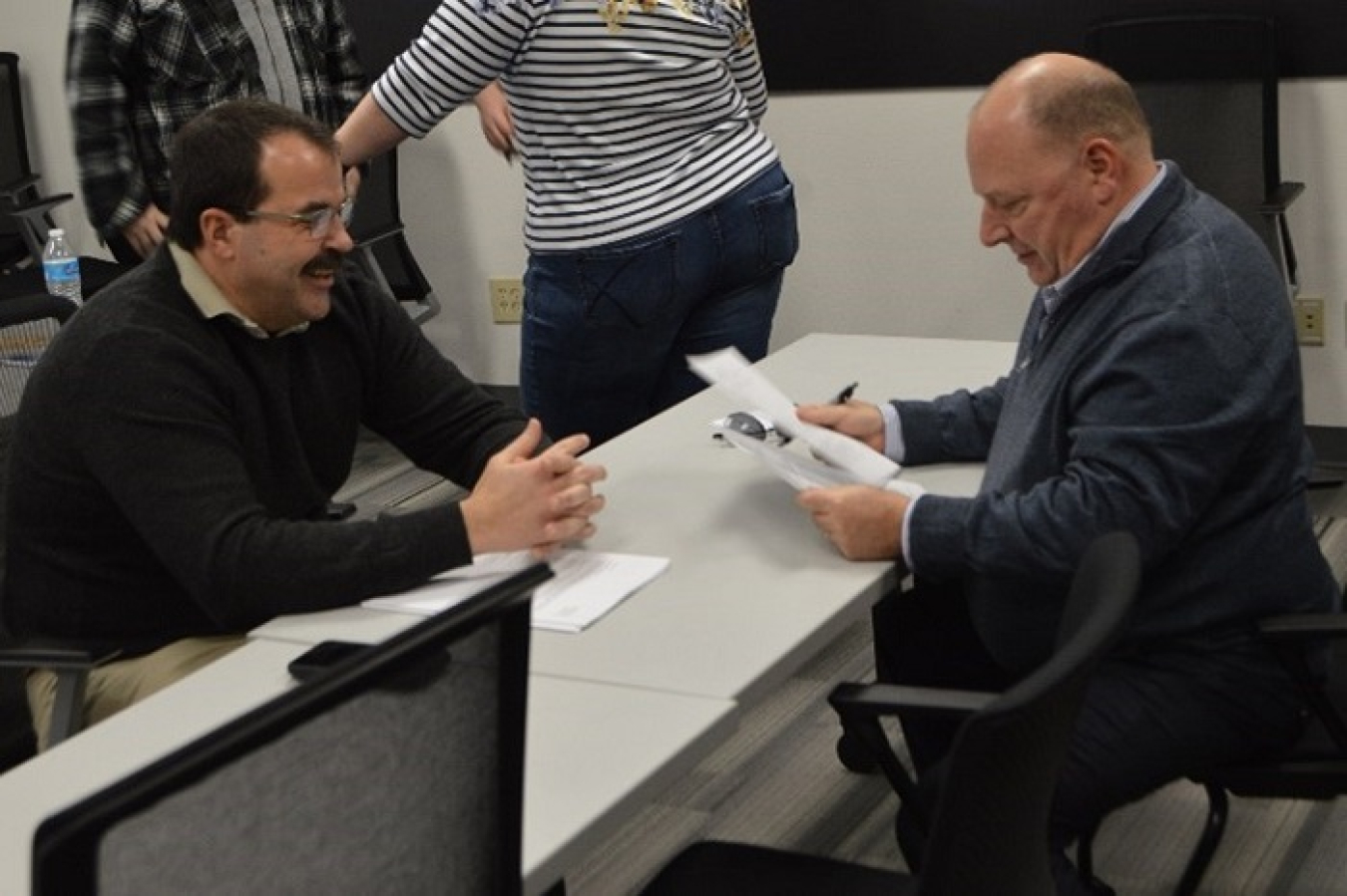 Jerry Kurtz, right, helps a veteran seeking employment at a resume workshop at WorkSource Columbia Basin in Kennewick, Washington prior to COVID-19 protocols being implemented. Kurtz and other Washington River Protection Solutions representatives regularly meet with veterans virtually and at local veterans events. 