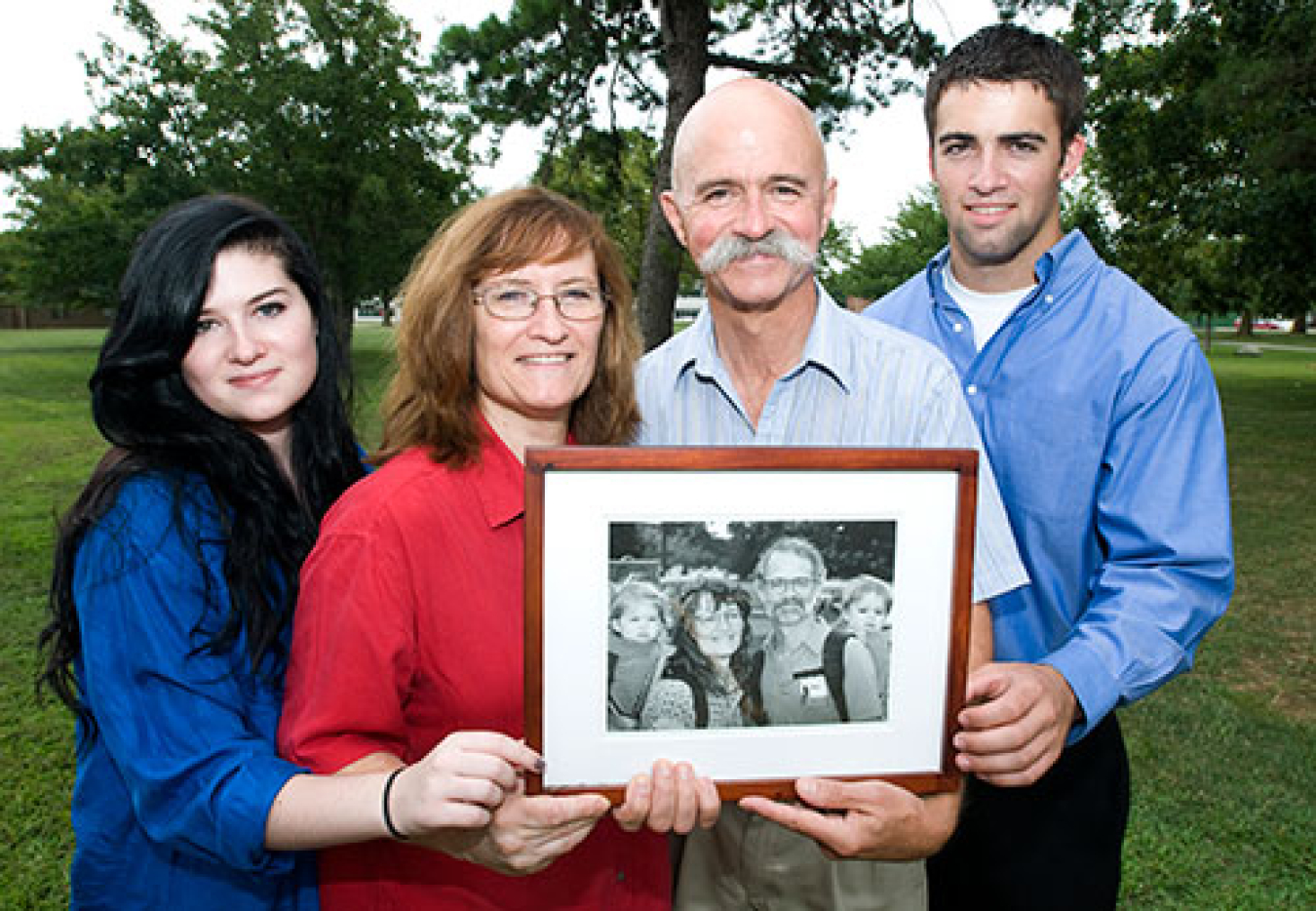 Brookhaven Lab is a family affair for the Sweets, as shown in this photo of Alan, Jean, Bob, and Marie taken during a poster session of Brookhaven's summer intern program in 2011, while they're holding a photo taken at the 45th Brookhaven Lab anniversary picnic in 1994. Bob works in the structural biology program at NSLS-II.