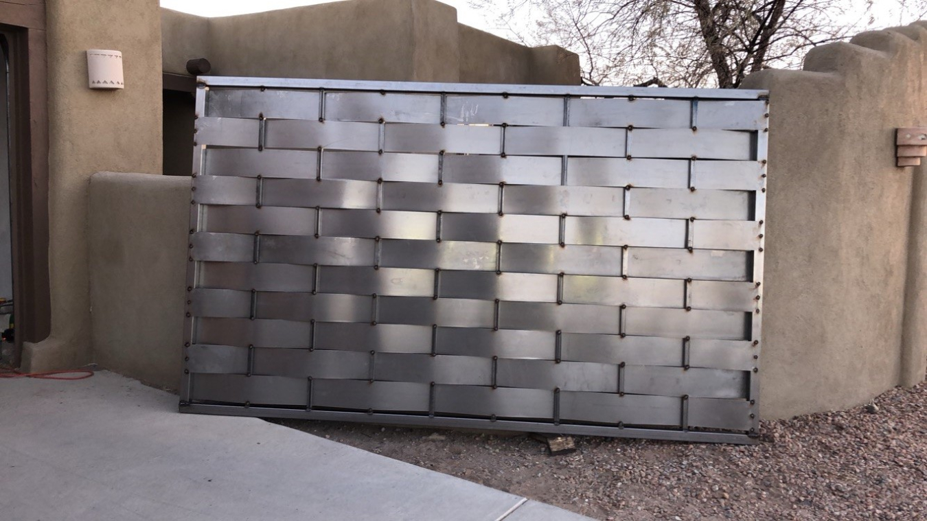 In an effort to teach his son how to work with his hands, NNSA Deputy Field Office Manager Gabriel Pugh and his son are building a metal fence together that is more than 200 feet long. 