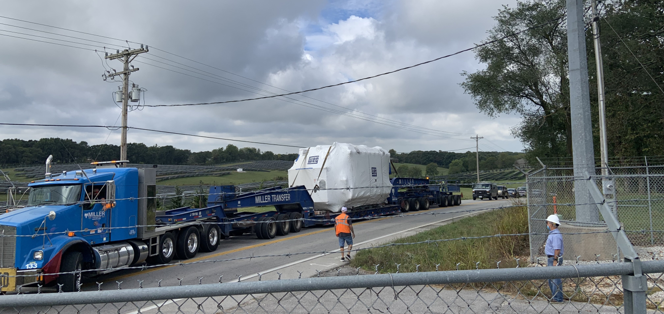 Carlos Valencia watches as the new autotransformer arrives on site at SWPA's Nixa Substation.