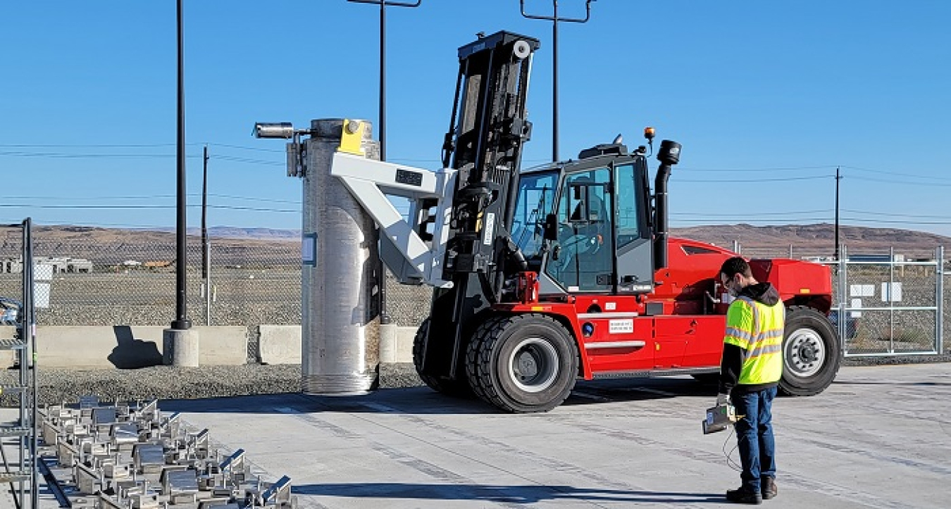 Workers install a 24,000-pound ion exchange column in the Tank-Side Cesium Removal System. The columns remove cesium from waste destined for processing at the Waste Treatment and Immobilization Plant.