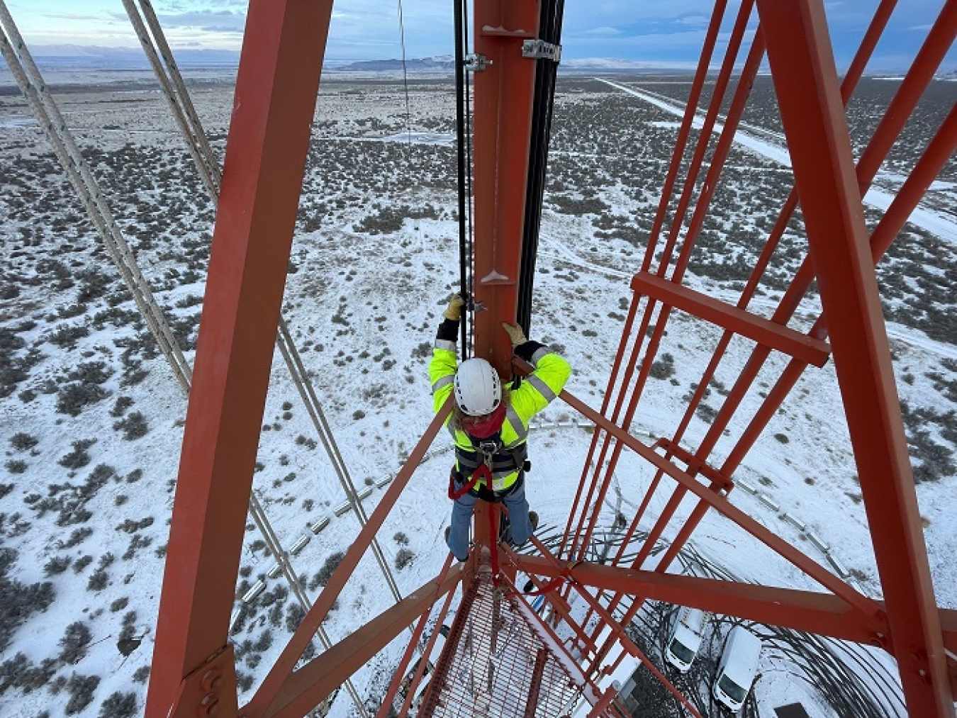 Bryan Hurt, a field support worker with Hanford Mission Integration Solutions, installs cables and antennas on the Hanford Site’s 405-foot meteorological tower.