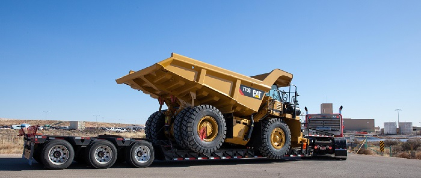 A new 40-ton salt haul truck arrives at EM’s Waste Isolation Pilot Plant. The machinery and its environmentally friendly diesel engine replace a standard diesel model that will be refurbished and used as a backup.