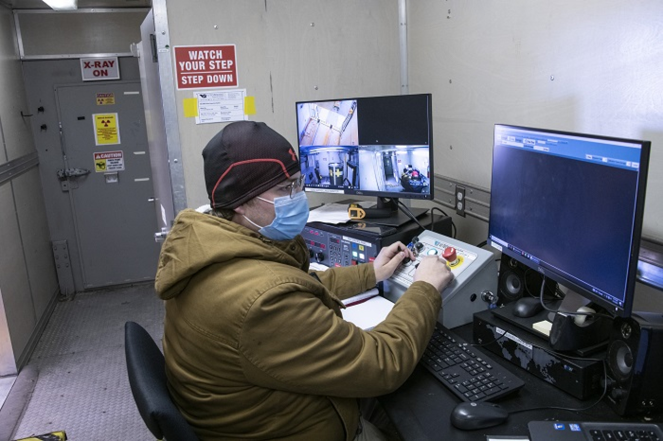 Remote operation allows for the characterization of a transuranic waste drum using a real-time radiography unit at the Solid Waste Management Facility at the Savannah River Site. Pictured is DOE Central Characterization Project subcontractor Tyler Watson.