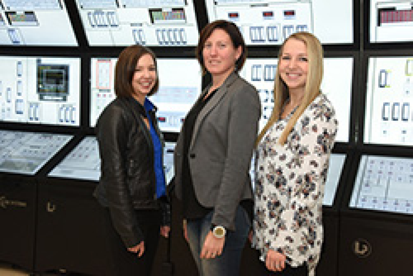 Three women smiling.