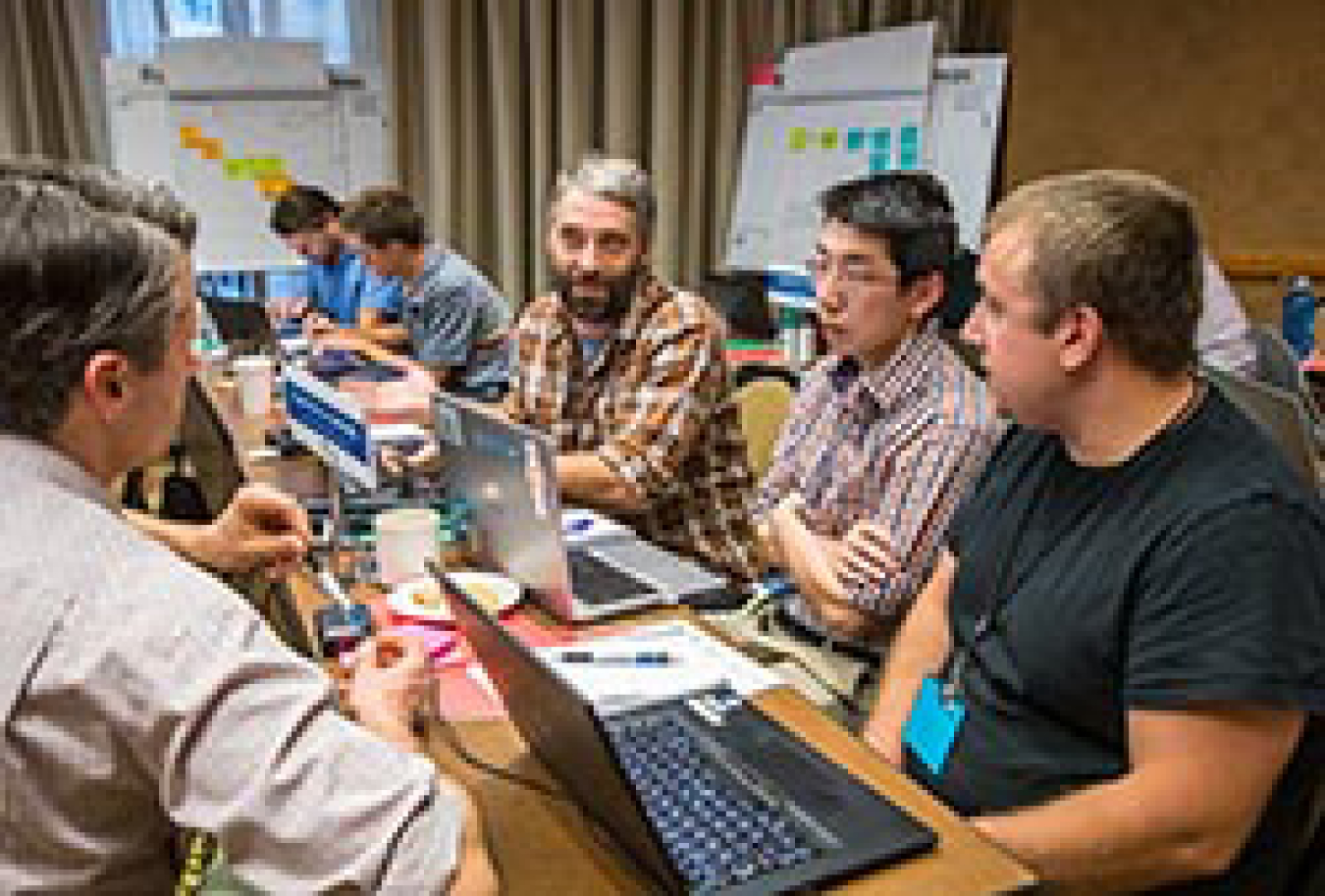 A group of people sitting at a table.