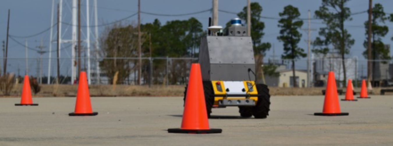 The Integrated Ground-based Autonomous Agent for Radiological Tracking (iGART) maneuvers through a course during a demonstration of the technology at Savannah River National Laboratory.