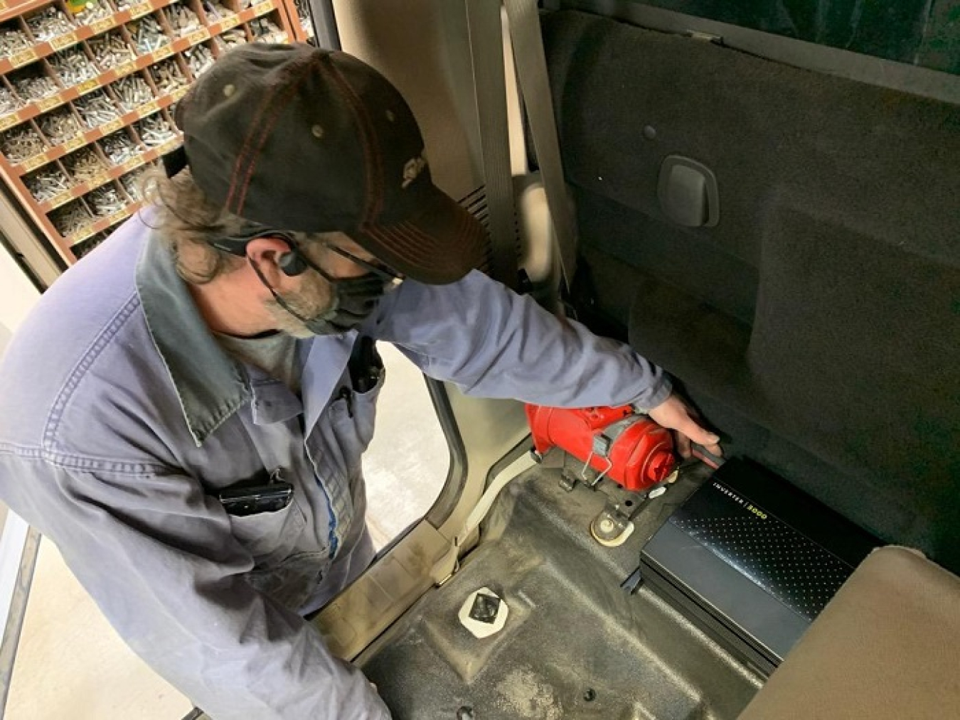 Hanford Mission Integration Solutions mechanic David Dean installs updates on a truck used by Washington River Protection Solutions workers to transport tank waste samples to the Hanford Site’s Analytical Laboratory.