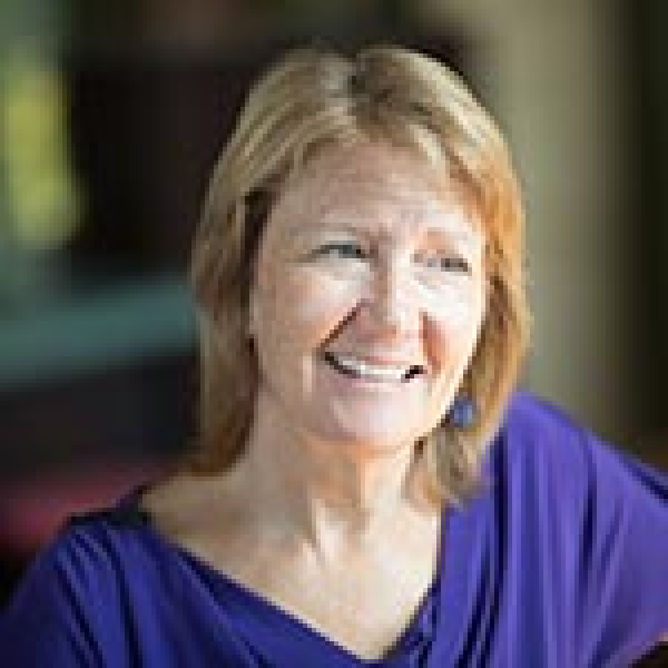 Image of a woman wearing a blue top