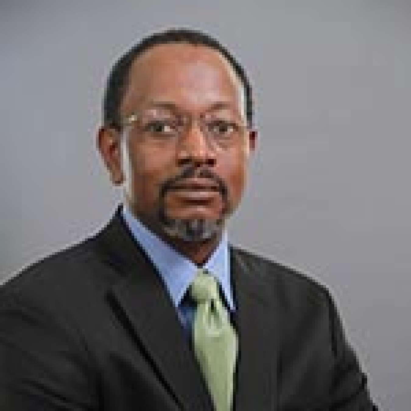 Image of a professional male wearing a suit and tie 