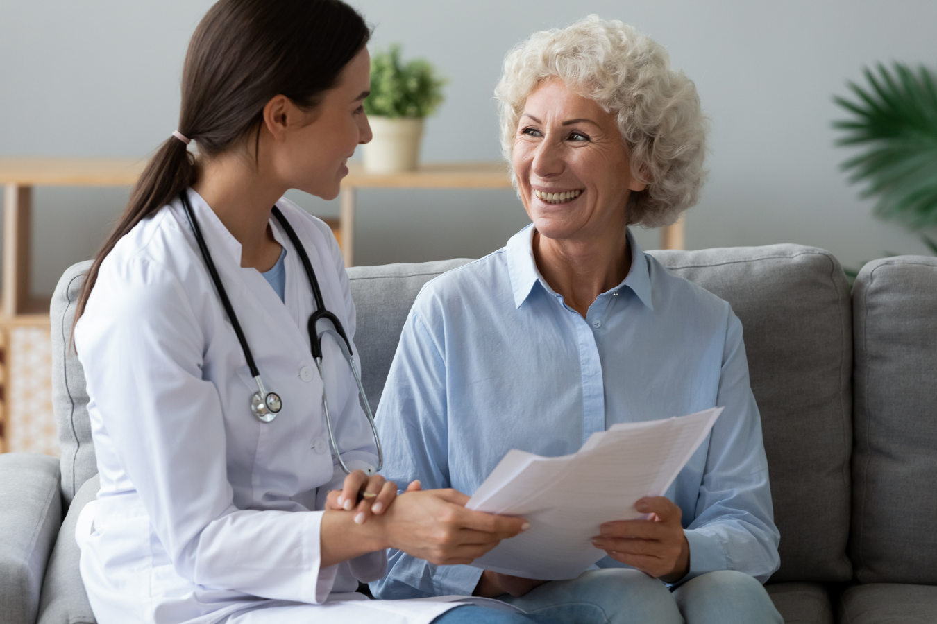 Female doctor communicating results to elderly patient