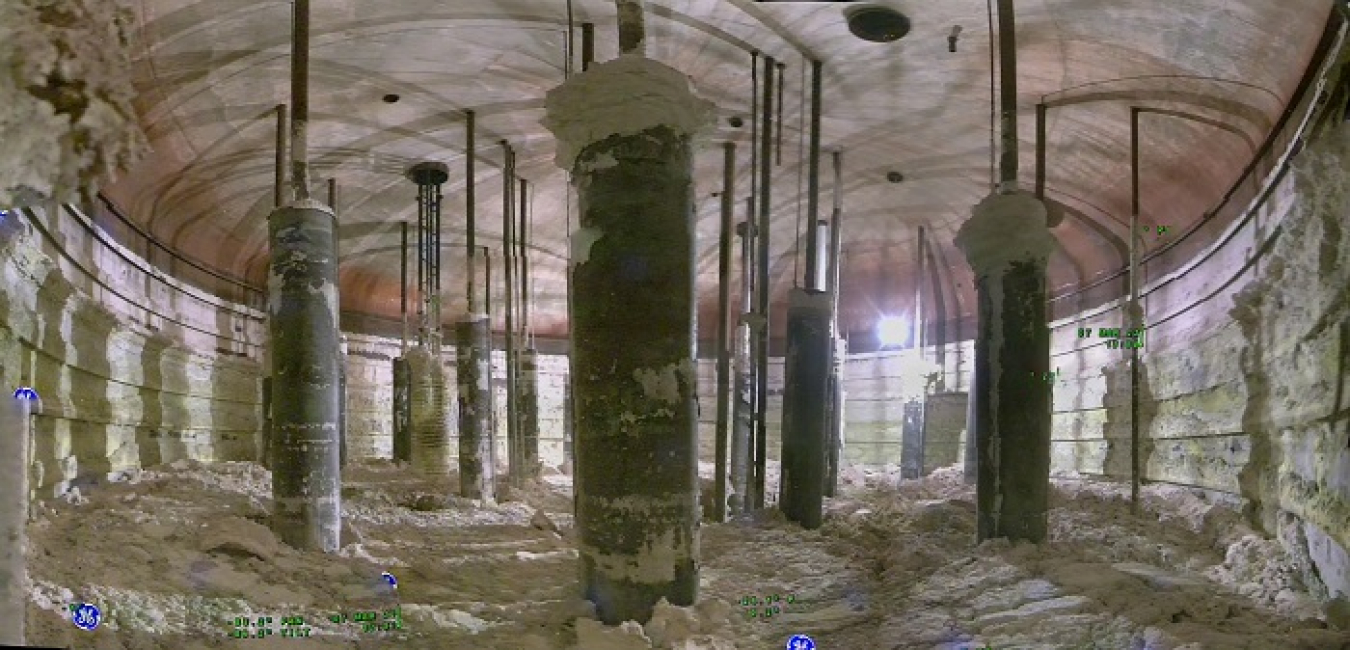 Waste retrieval from Tank AX-101, the last of four tanks to be retrieved in the Hanford Site’s AX Farm, is set to begin this fall. This in-tank photo shows the salt-based waste and the tank’s 22 air-lift circulators. 