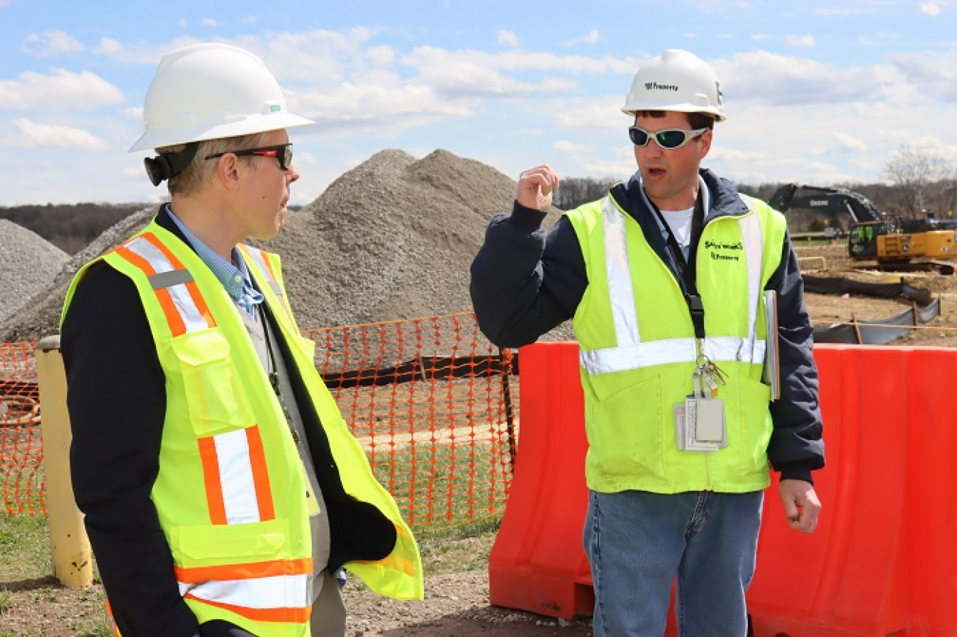 Fluor-BWXT Portsmouth Soil Remediation Manager Steven Thompson, right, explains ongoing work at the X-231B excavation project at the Portsmouth Site to EM Senior Advisor William “Ike” White.