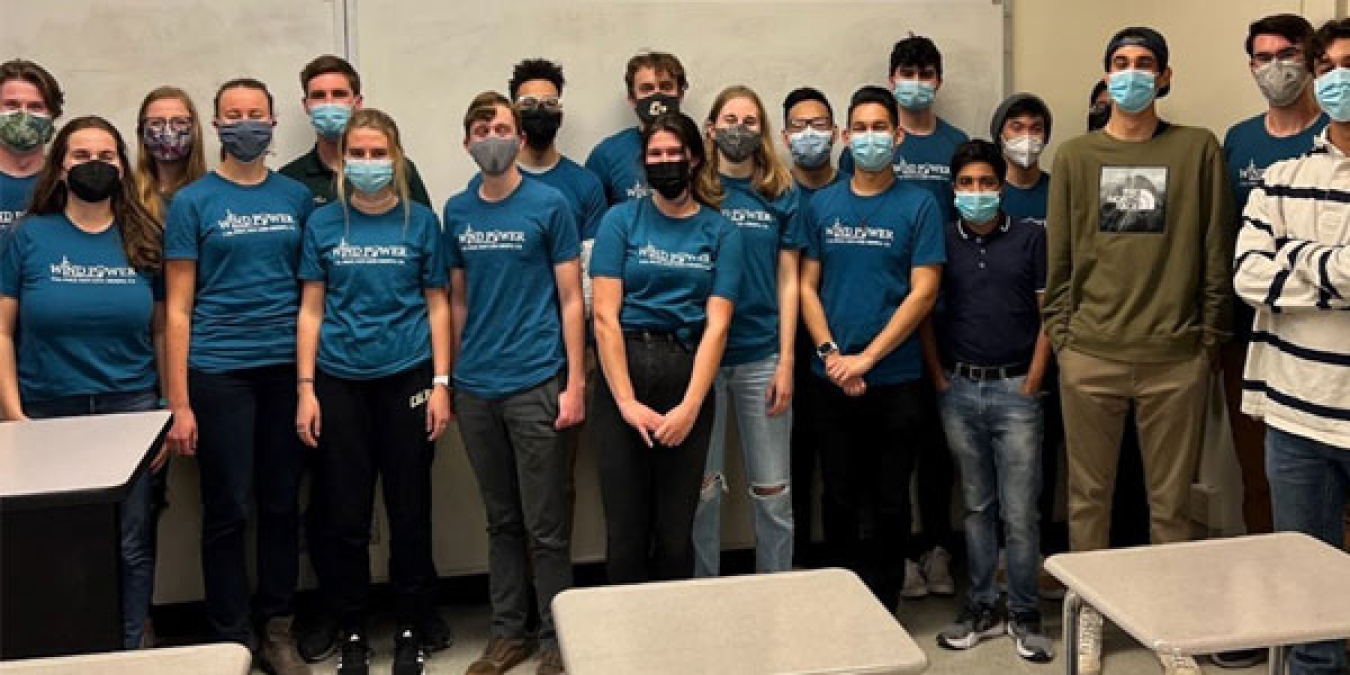 Students in masks wearing matching tee shirts with the words “Wind Power Cal Poly.”