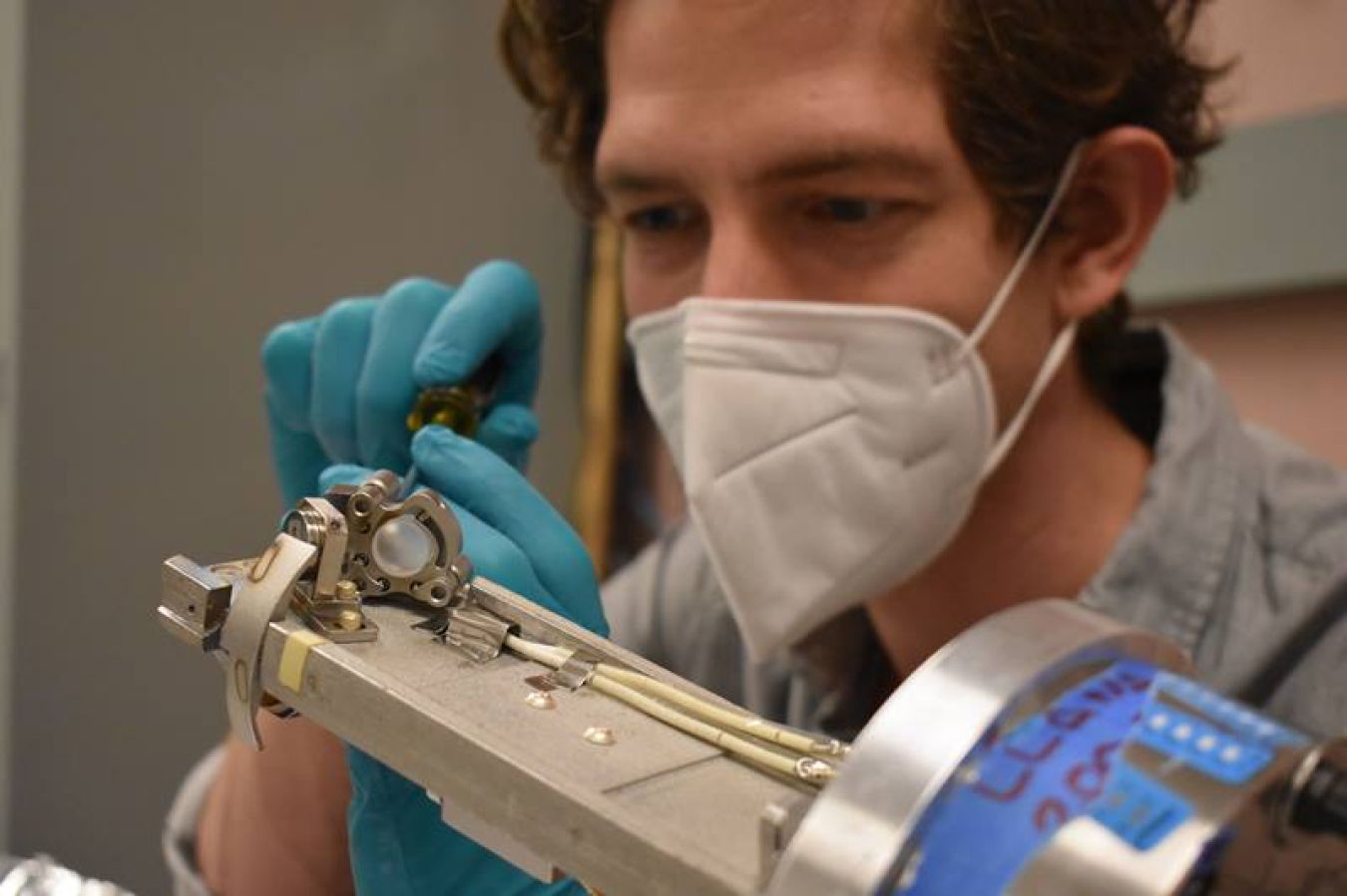 Massachusetts Institute of Technology physics graduate student Aaron Rosenthal from the Plasma Science and Fusion Center aligns optical components on the Lyman-alpha Measurement Apparatus.