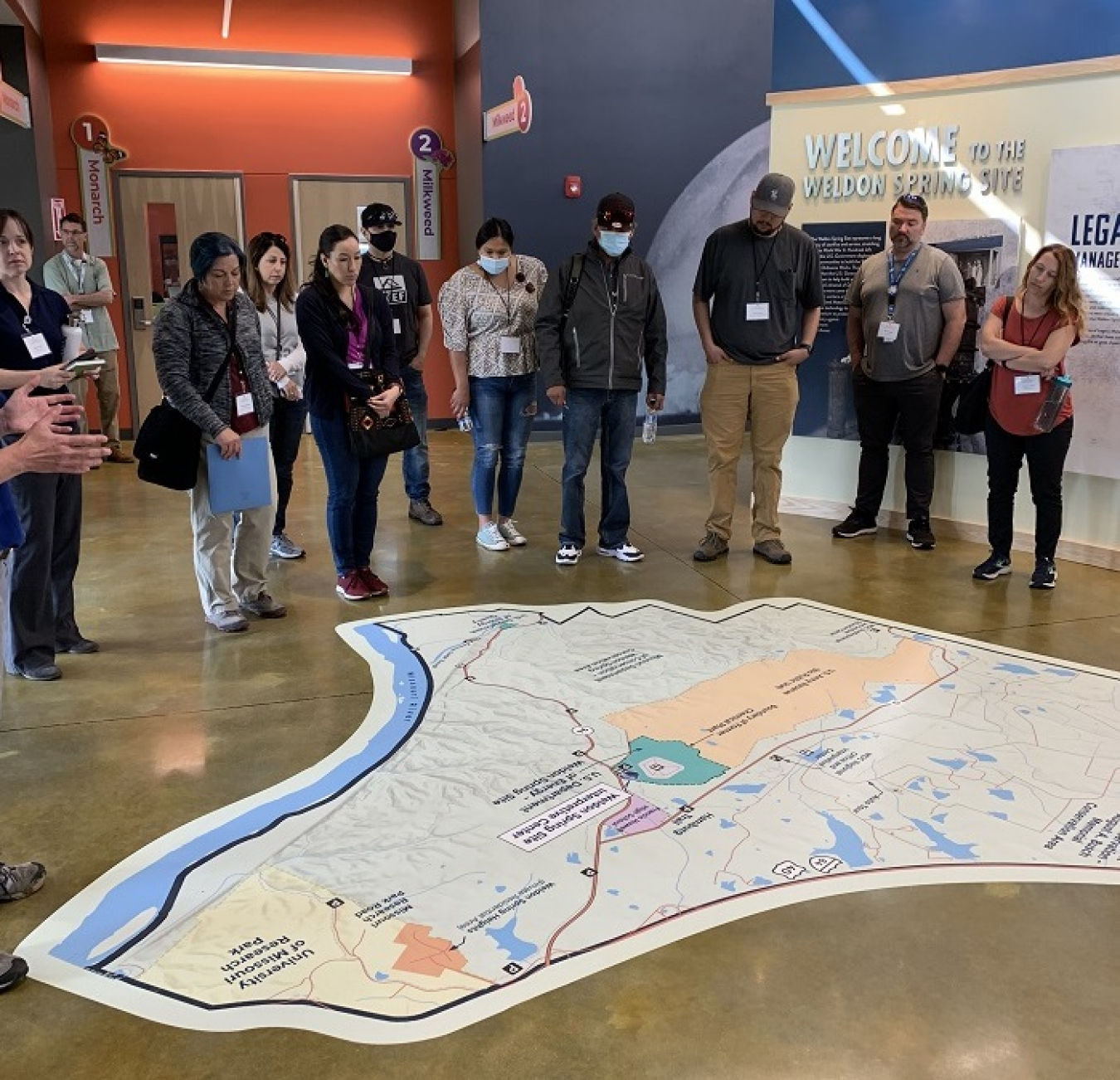 State and Tribal Government Working Group members view a map of the Weldon Springs area near St. Louis, Missouri, during a tour of the new Weldon Springs Interpretive Center.