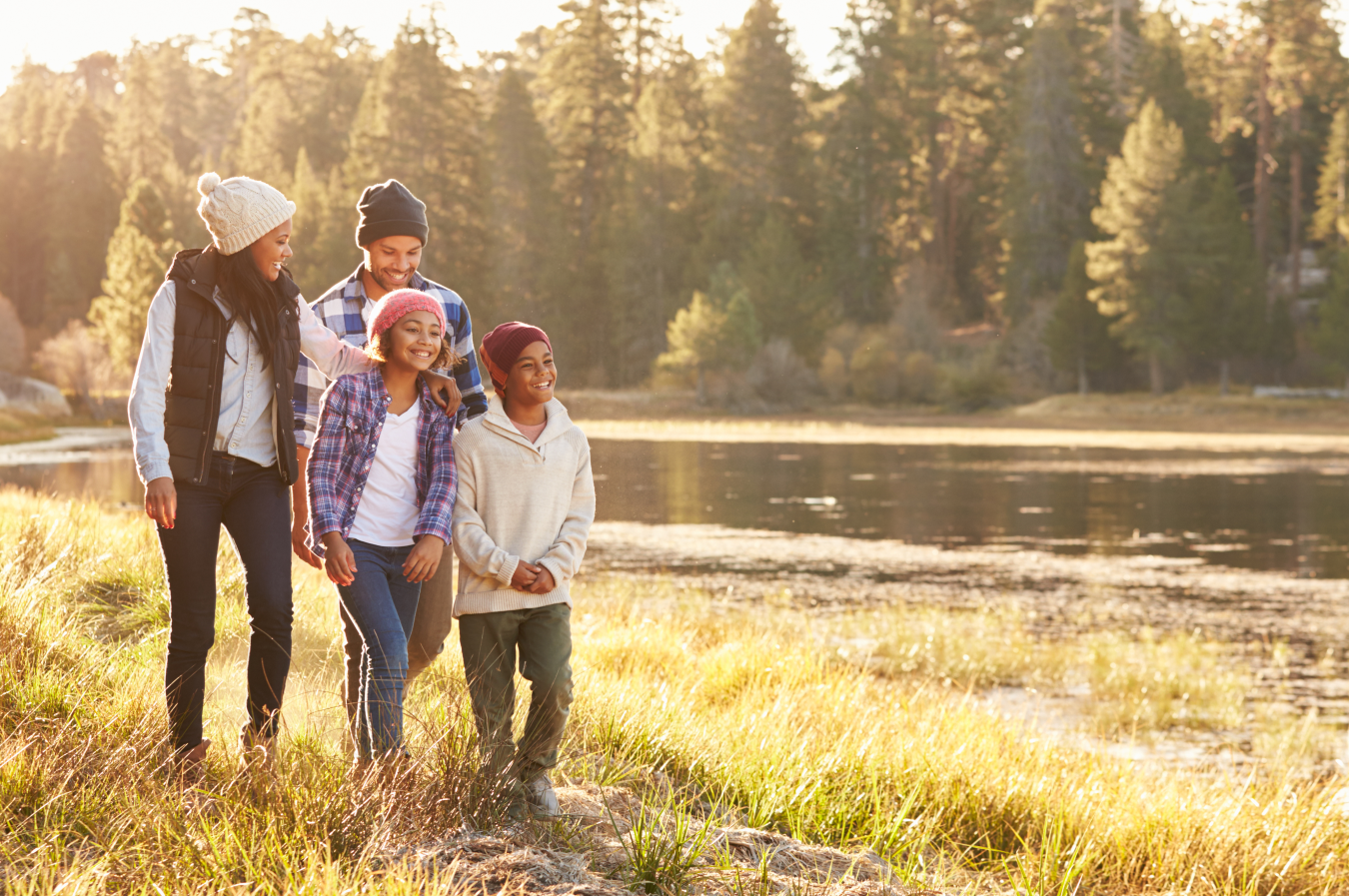 Family walking along creek bed