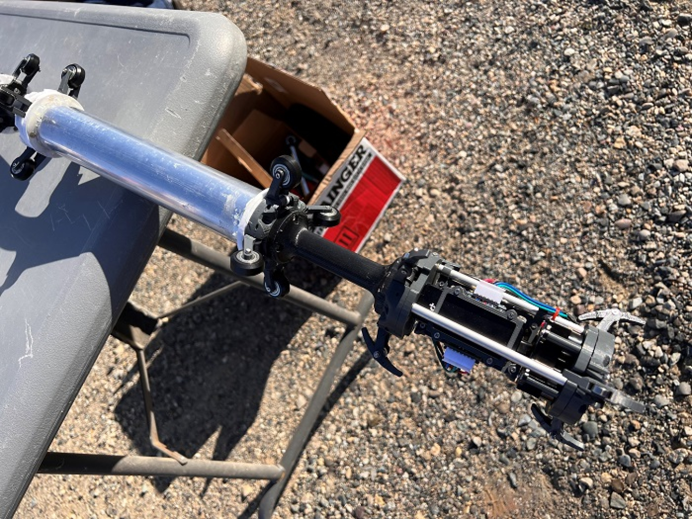 The lead segment of a pipe crawler is equipped with a camera, mock-up radiation scanner and other sensors. A 3D printer was used to help build the crawler.