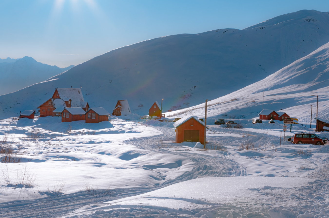 Photo of several buildings on a snow-covered mountainside.