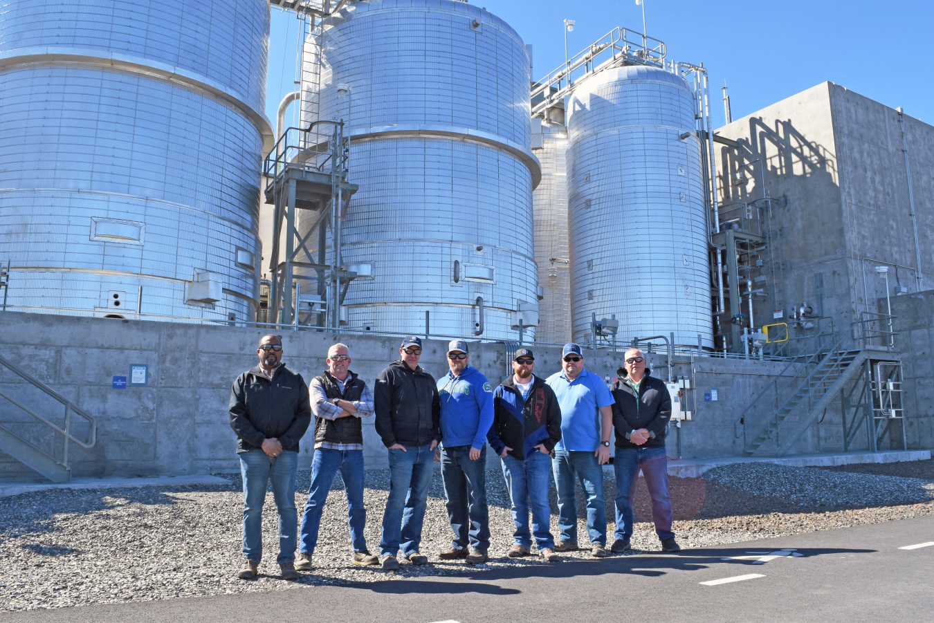 Members of the Hanford Waste Treatment and Immobilization Plant commissioning organization are pictured in front of the Effluent Management Facility. From left are Jeffrey Peterson, John Reyff, Scott Hennick, Jeffrey Blosil, Tyson Warner, Lance Pappas and Pat Mohondro.