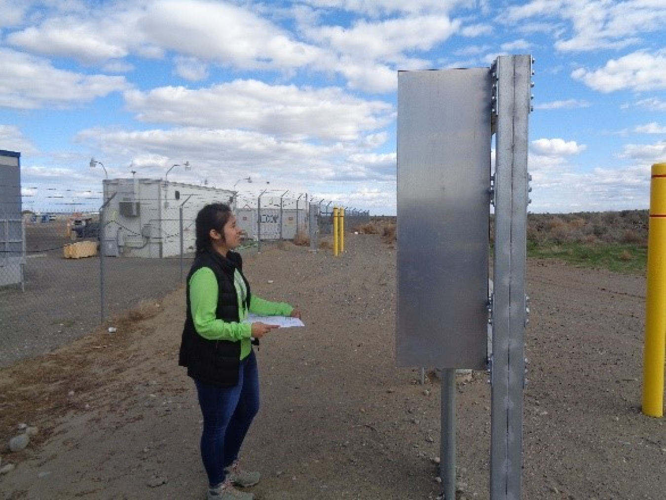 Gabriela Sanchez, project engineer and test coordinator for EM Richland Operations Office contractor Hanford Mission Integration Solutions, checks on a pipeline project supporting the Hanford Site’s Waste Treatment and Immobilization Plant.