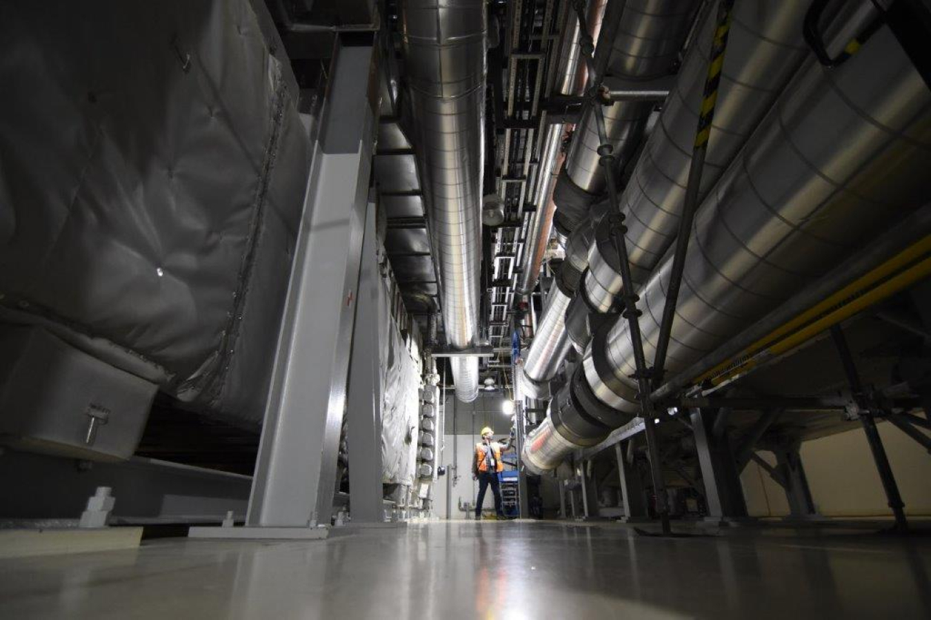 A crew member inspects part of the Low-Activity Waste Facility’s exhaust treatment system at the Hanford Site’s Waste Treatment and Immobilization Plant.