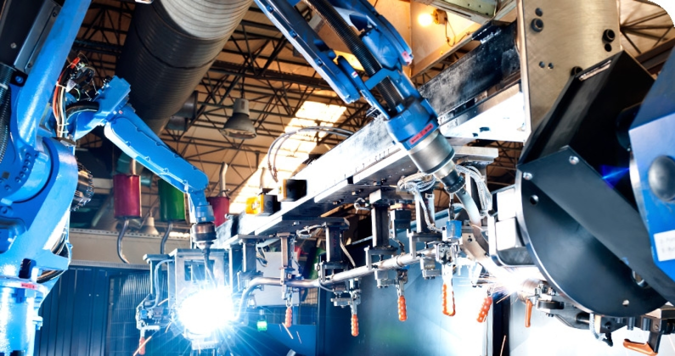 Robotic arms in a manufacturing facility