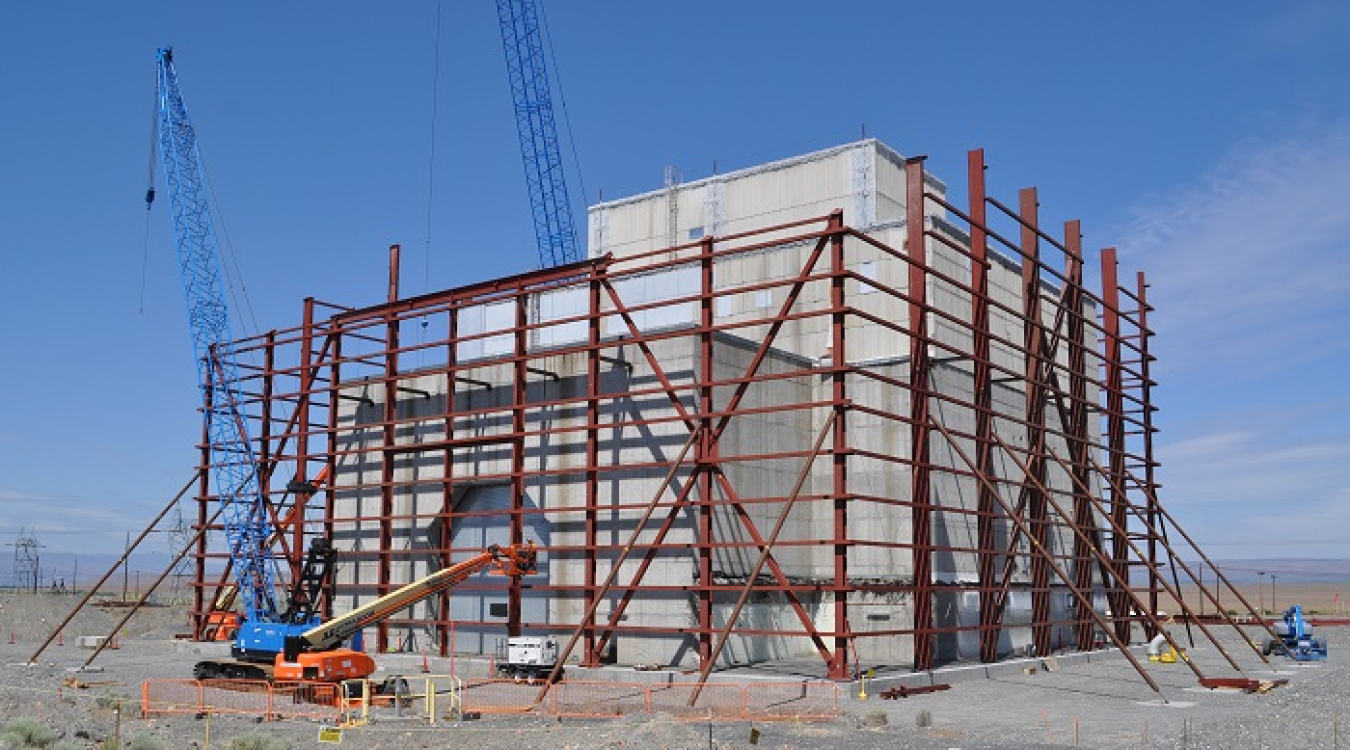 Workers with EM contractor Central Plateau Cleanup Company last month placed the first steel columns — each weighing up to 28 tons — for a protective enclosure, or cocoon, over the former K East Reactor building at the Hanford Site.