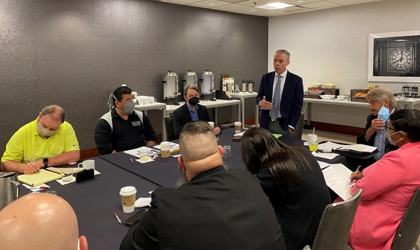 EM Senior Advisor William “Ike” White speaks with union leaders at a recent Atomic Energy Workers Council meeting in Washington, D.C.